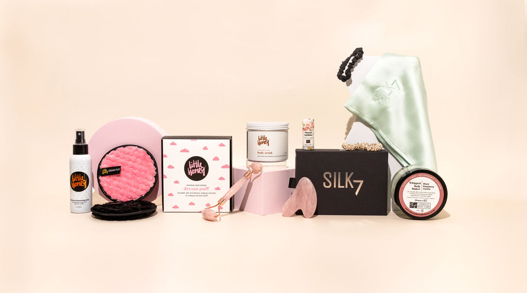 Skincare and Beauty Supplies sit side by side with a pink background. Products sold by online skincare company Magnolia Beauty in New Zealand.
